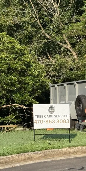 Supreme Arbor LLC yard sign on residential lawn
